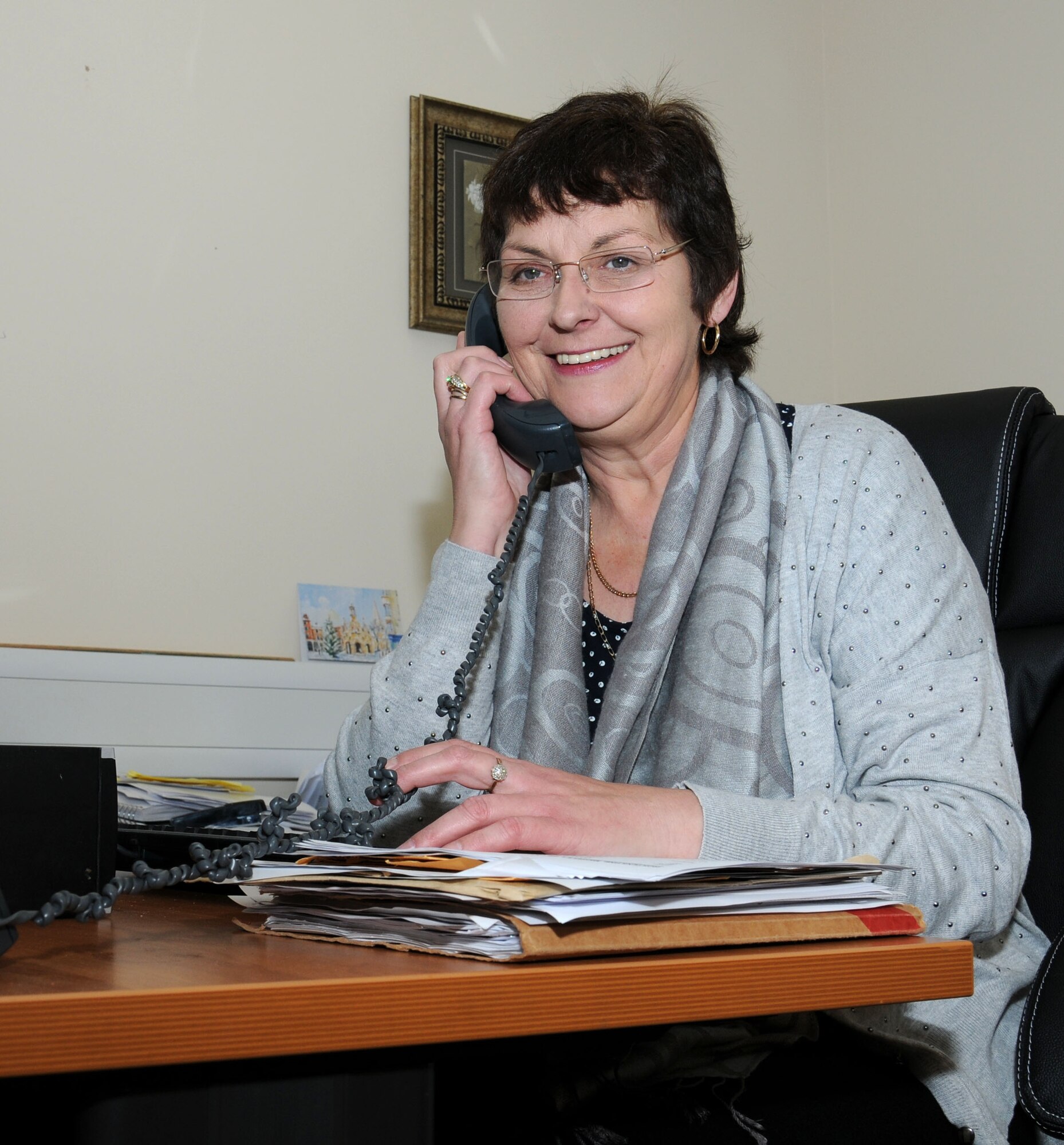 Michele Hortenstine, 100th Force Support Squadron Civilian Personnel Office United Kingdom liaison officer from Sheffield, England, calls to set up a policy meeting Dec. 31, 2014, on RAF Mildenhall, England. Hortenstine provides advice and assistance to commanders and managers on civilian personnel management. She ensures compliance with UK’s legal and regulatory requirements under the Air Force regional environment. (U.S. Air Force photo by Gina Randall/Released)