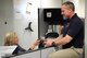GOODFELLOW AIR FORCE BASE, Texas – Lorraine J. Allen, 312th Training Squadron supply technician, hands an Apple iPad mini to Bill Bockelman, 312th TRS instructor, at the Louis F. Garland Department of Defense Fire Academy Jan. 20. To maintain accountability, instructors have to check out the iPad minis from the supply technician before use. (U.S. Air Force photo/ Airman 1st Class Devin Boyer)