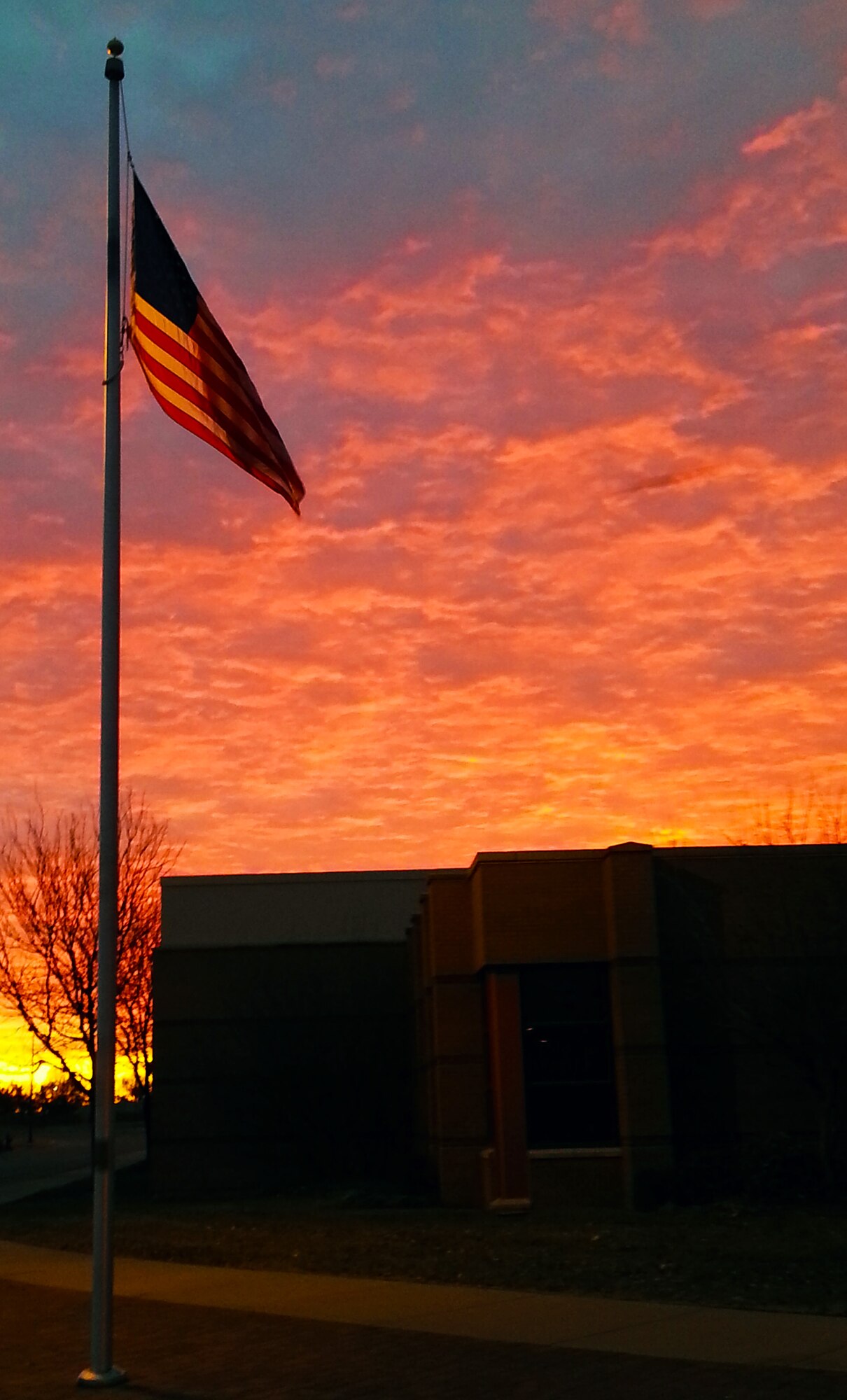 The Kansas sun crests the horizon over McConnell Air Force Base, Kan., Jan. 21, 2015.  McConnell is home to the 22nd Air Refueling Wing, the Air Force Reserve 931st Air Refueling Group, and the Kansas Air National Guard 184th Intelligence Wing.  (U.S. Air Force photo by Capt. Zach Anderson)