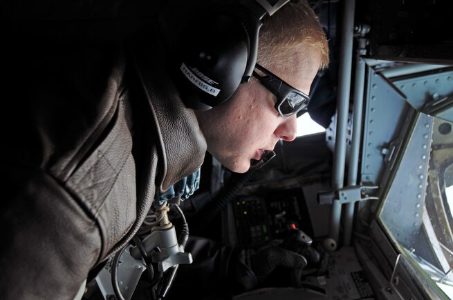 Staff Sgt. Brad Harris, a boom operator with the Utah Air National Guard's 191st Air Refueling Squadron, trains NATO E-3A pilots on air refueling on Jan. 7, 2015. (Air National Guard photo by Staff Sgt. Annie Edwards/RELEASED)