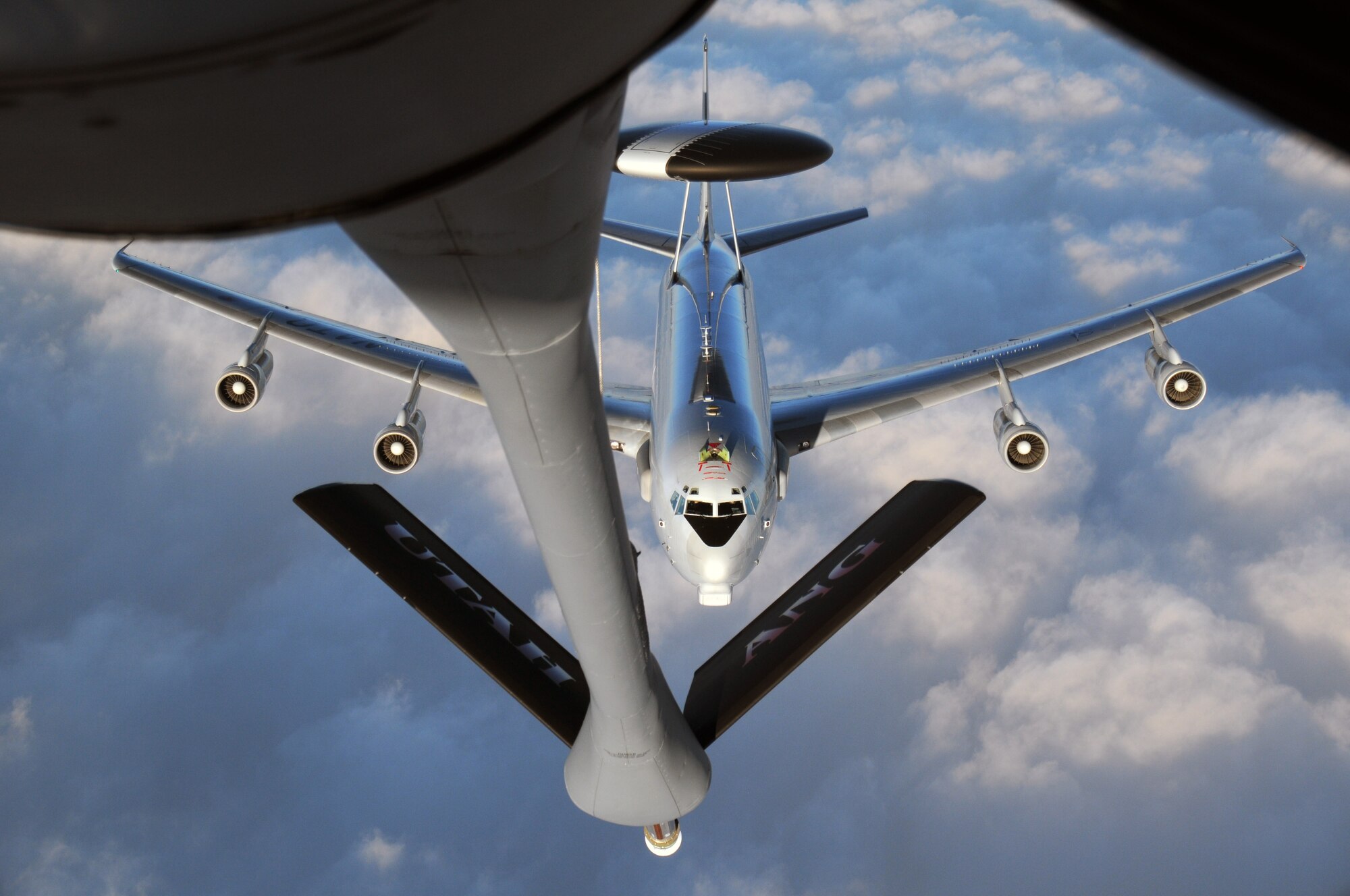 A NATO E-3A AWACS aircraft approaches a Utah Air National Guard KC-135R Stratotanker for air refueling during a training flight over Germany on Jan. 13, 2015. (Air National Guard photo by, Staff Sgt. Annie Edwards/RELEASED)