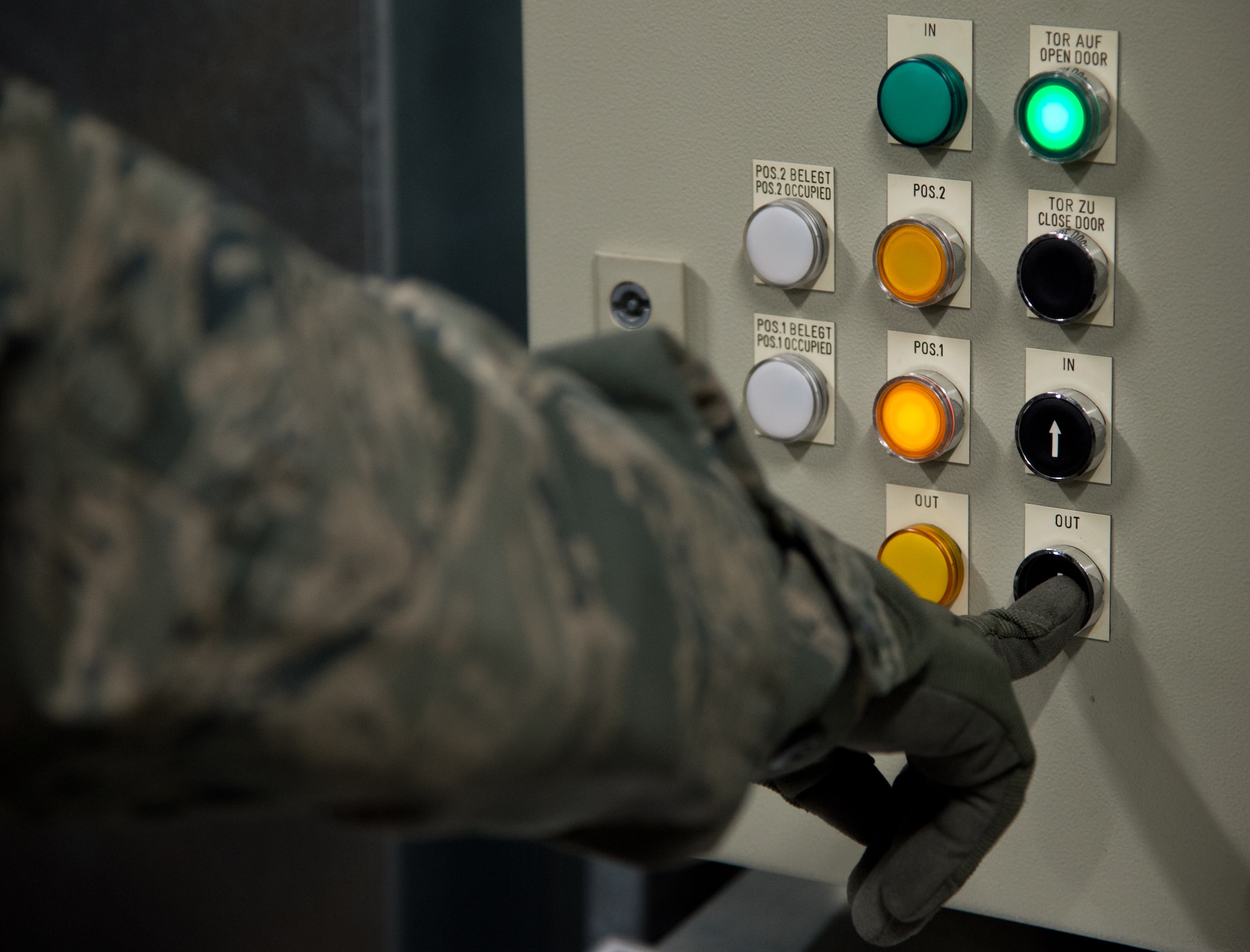 Senior Airman Eddy Santibanez, 721st Aerial Port Squadron special handler, pushes a button that removes sensitive cargo from storage, at Ramstein Air Base, Germany, Jan. 16, 2015. Along with handling hazardous and refrigerated material, the 721st APS Airmen also handle the transfer of fallen service members from the down range to Dover Air Force Base, Delaware. (U.S. Air Force photo/ Senior Airman Jonathan Stefanko)