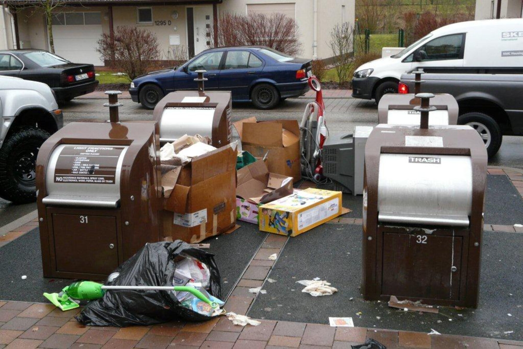 An example of unacceptable disposal of bulk trash. Keep the bin platforms free and clear of any boxes, large items and excess garbage bags. Having items on the platforms prevents the contractor from being able to access the bins to empty them. There are recycling centers located on Ramstein and Vogelweh available to on-base residents when the bins are full. (Courtesy photo)