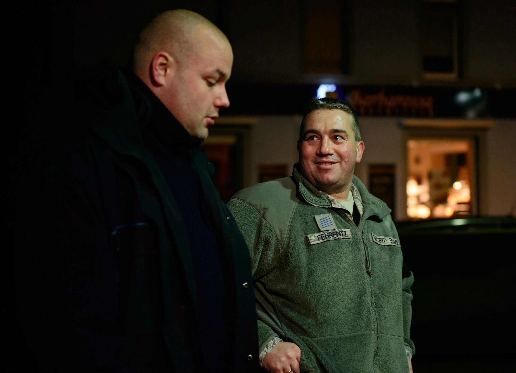 (Right) Zivil Polizei Volker Fehrentz, 569th U.S. Forces Police Squadron, discusses procedures with a Kaiserslautern Ordnungsamt, or office of public order, officer, at Kaiserslautern, Germany, Jan. 17, 2014. Fehrentz and the 569th USFPS conducts joint patrols with the Ordnungsumt and Polizei to ensure the area is safe and secure. (U.S. Air Force photo/ Senior Airman Armando A. Schwier-Morales)