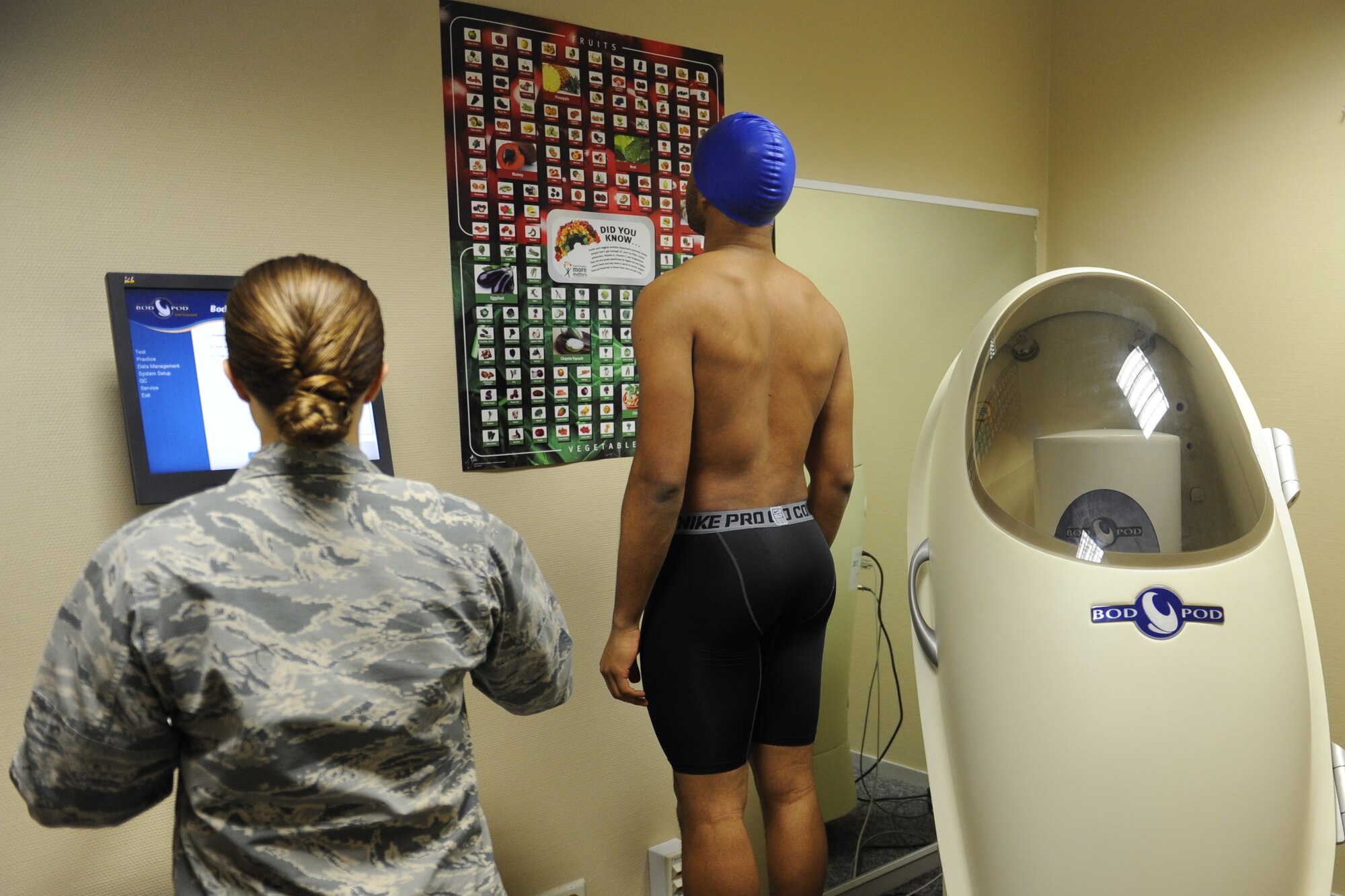 Airman First Class Brian Moorehead, 721st Aerial Port Squadron passenger service agent, steps on a scale before he uses a Bod Pod to measure his body composition on Ramstein Air Base, Germany, Jan. 14, 2015. The machine measures an individual’s weight, body fat percent and change in body fat and muscle mass. The Bod Pod is available to all ID cardholders over the age of 18. (U.S. Air Force Photo/Airman 1st Class Michael Stuart)
