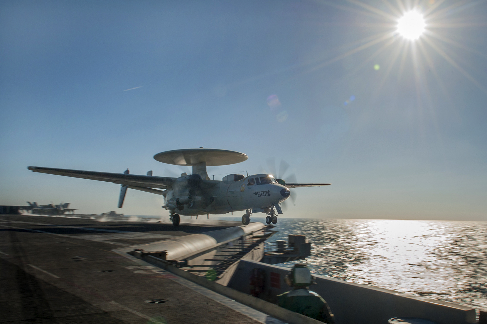 An E-2C Hawkeye from the Carrier Airborne Early Warning Squadron 116  launches from the flight