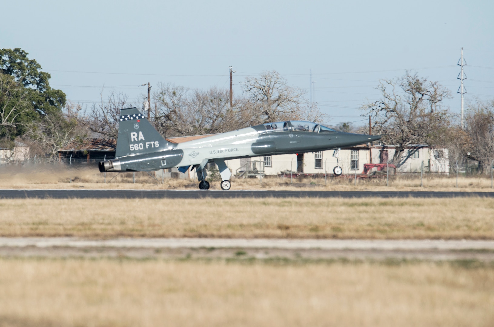 The first T-38C Talon lands at the Joint Base San Antonio-Randolph Seguin Auxiliary Airfield during a ribbon cutting event signifying the reopening of the JBSA-Randolph Seguin Auxiliary Airfield Jan. 20.  Upon completion of a three-year construction project, the airfield is now ready for flying by members of the 560th Flying Training Squadron.  The airfield is crucial for “touch and go” training that qualifies fighter and bomber pilots as instructor pilots in the T-38C Talon.  The reconstructed runway increases flight safety by distributing training around the San Antonio area, which means fewer aircraft and less congestion around Joint Base San Antonio-Randolph. (U.S. Air Force photo by Johnny Saldivar)
