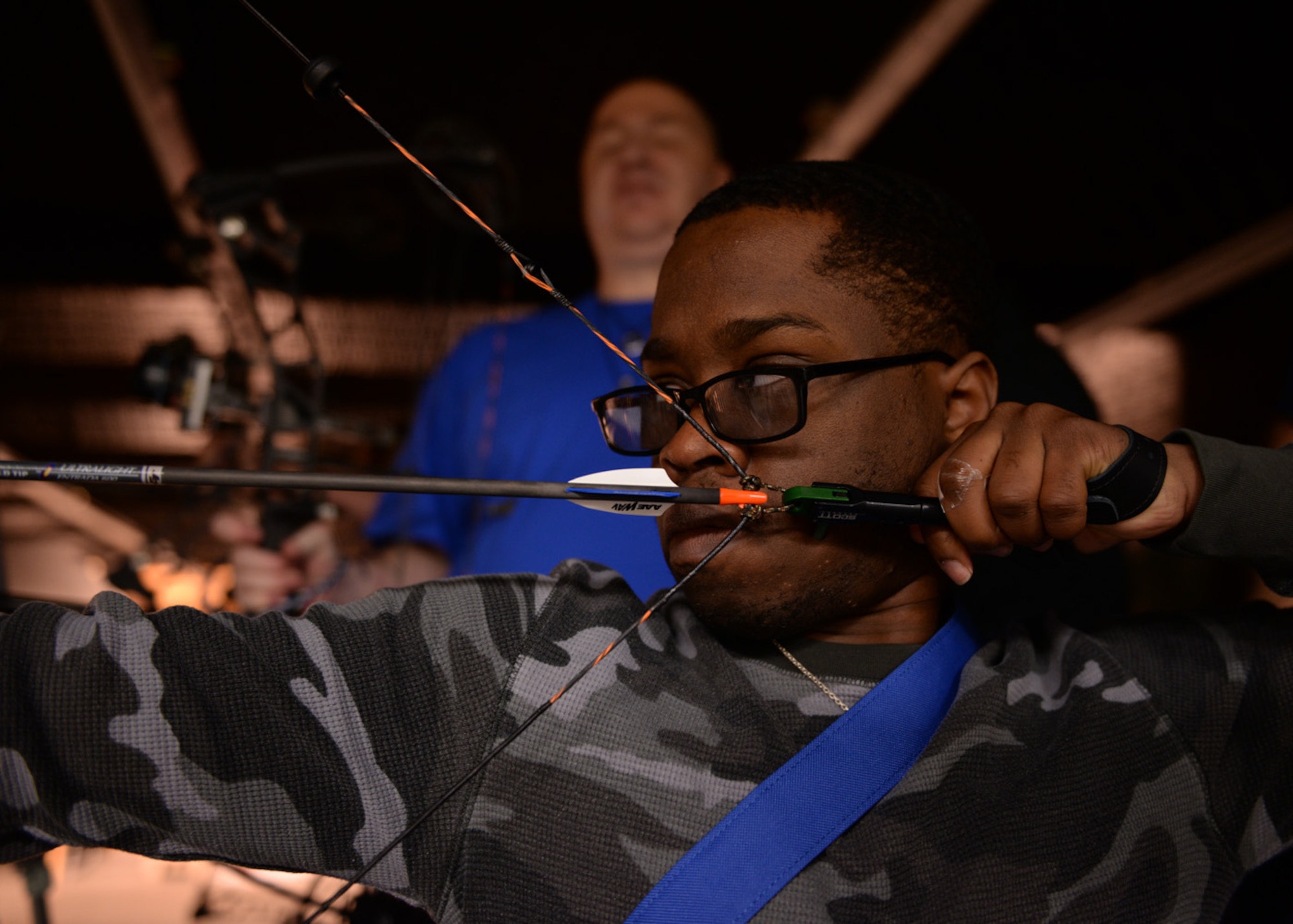 Senior Airman Ryan Cureton takes aim during the archery event for the Air Force Wounded Warrior Adaptive Sports and Reconditioning Camp at Joint Base San Antonio-Randolph, Texas, Jan 21, 2015. Cureton suffered a traumatic brain injury after an auto accident and has suffered from limited vision since. (U.S. Air Force photo by Tech. Sgt. Joshua Strang)