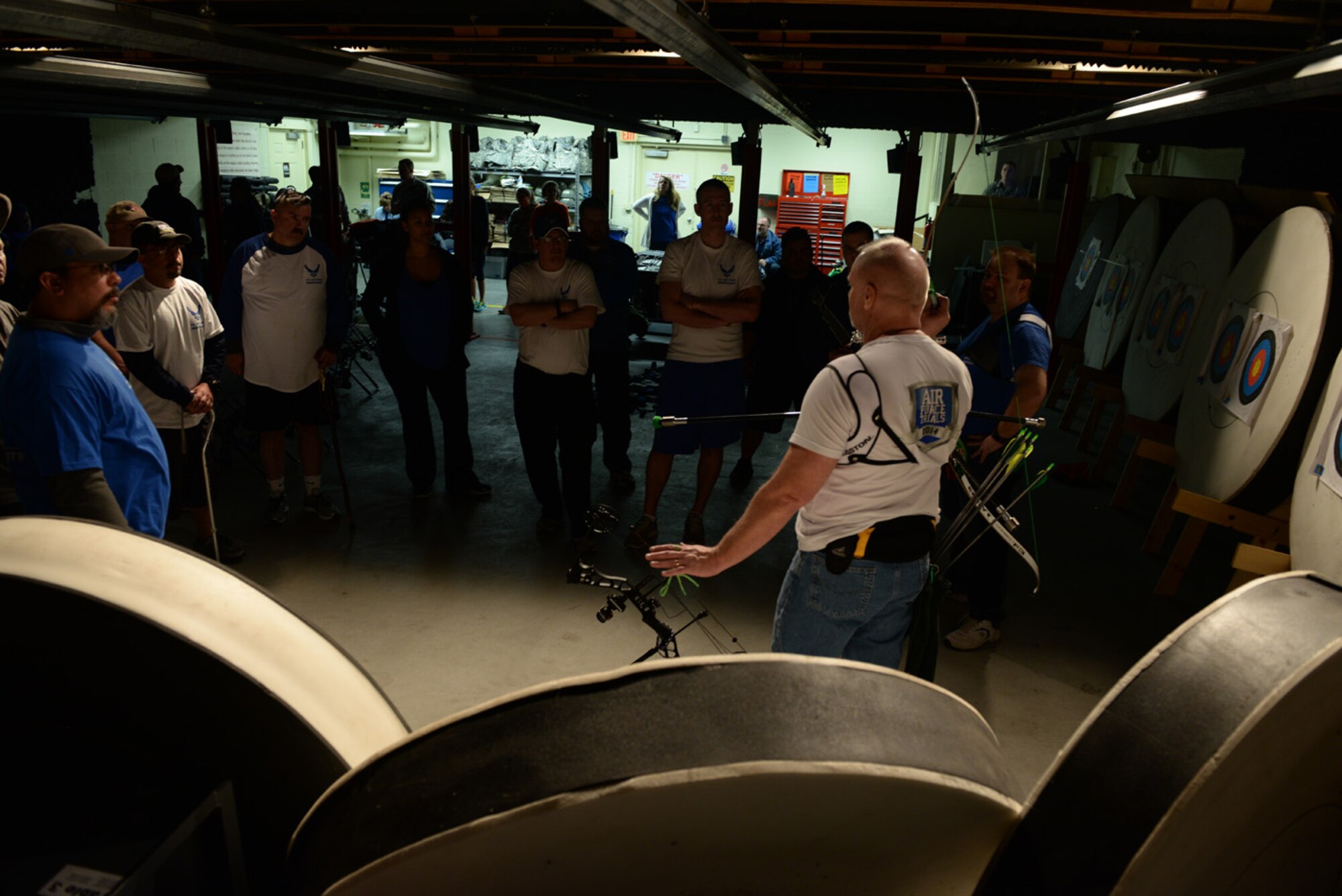 Wounded Warriors listen to direction before the archery event for the Air Force Wounded Warrior Adaptive Sports and Reconditioning Camp at Joint Base San Antonio-Randolph, Texas, Jan 21, 2015. The AFW2 mission statement is to motivate and encourage participation in recreational and competitive adaptive sports among the wounded, ill and injured to enhance recovery. (U.S. Air Force photo by Tech. Sgt. Joshua Strang)