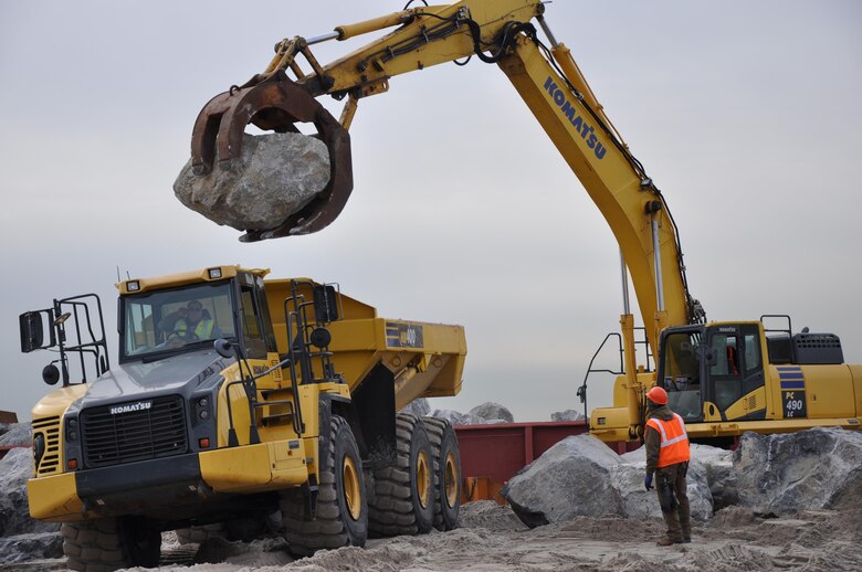 Contractors working for the U.S. Army Corps of Engineers move stone that is being delivered to the Sea Gate work site in Brooklyn January 21, 2015. The work at Sea Gate is an improvement upon the larger Coney Island Coastal Storm Risk Management Project and involves the construction of four stone T-groins, a stone spur on the West 37th Street Groin and reinforcement of the Norton Point Dike and the West 37th Street Groin. The project also includes the placement of roughly 125,000 cubic yards of sand, which will take place later in construction.