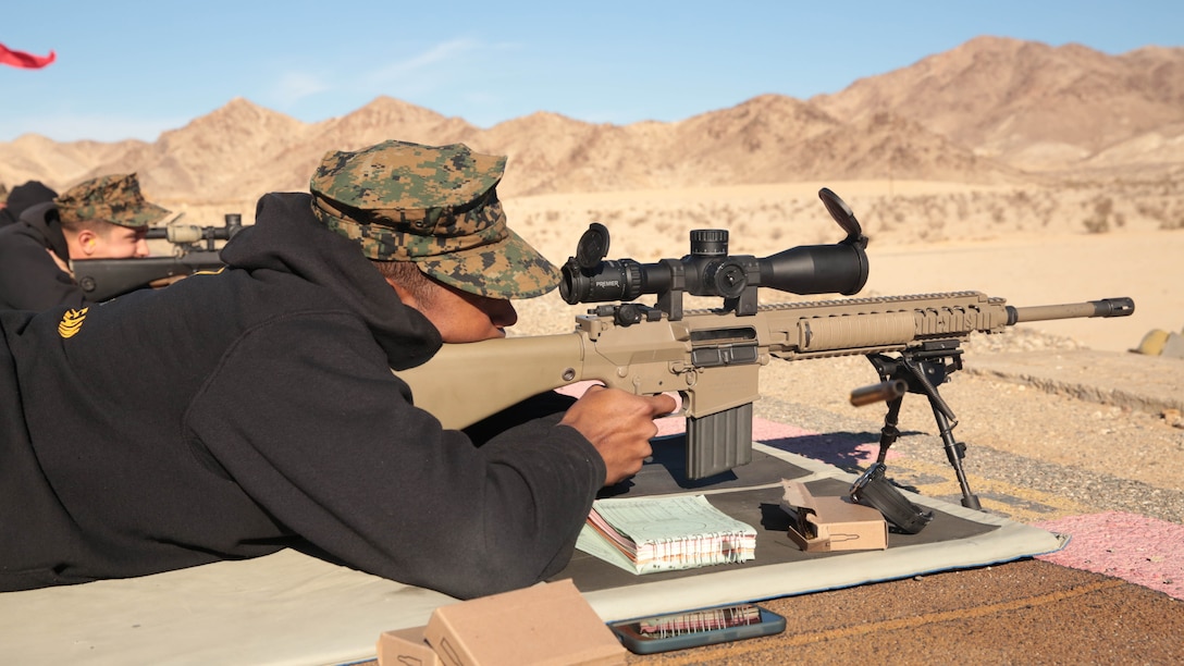 Lance Cpl. Egber Piza, takes his shot during the Combat Center DieSeL Classic at the base Qualification Range, Jan. 17, 2015. The competition is split up into individual and team matches. 