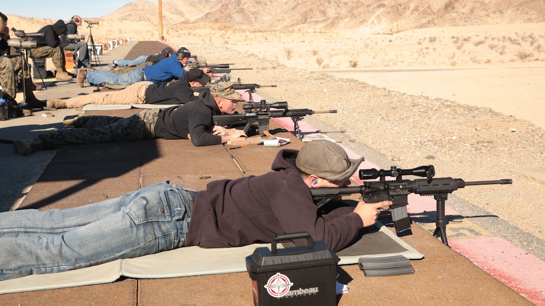 Participants prepare to shoot during the Combat Center DieSeL Classic at the base Qualification Range, Jan. 17, 2015. This is one of several competitions that the Combat Center shooting team participates in each year.