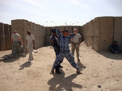 Soldiers of the New York National Guard's 206th Military Police Company monitor the Iraqi Emergency Response Battalion search and seizure procedures during a training course held at the Basra Operations Center in Basra, Iraq March 15, 2010.