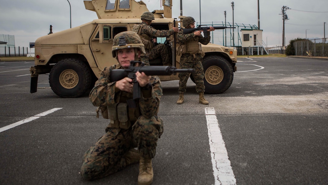 Members of Bravo Company, 1st Battalion, 1st Marines provide security during convoy operations training, Jan. 14, 2015, at Penny Lake Fields aboard Marine Corps Air Station Iwakuni, Japan. The training is part of combined arms training focused on improving unit cohesion and combat readiness.