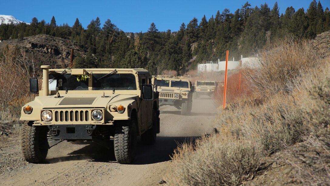 Motor Transport Marines with 2nd Battalion, 6th Marine Regiment, and Combat Logistics Battalion 26, Headquarters Regiment, 2nd Marine Logistics Group, conduct a simulated convoy throughout the hills aboard Bridgeport, California, Jan. 14, 2015. The Marines learned how to operate the High Mobility Multipurpose Wheeled Vehicles and the small unit support vehicles in mountainous terrain during classroom instruction and practical application. 
