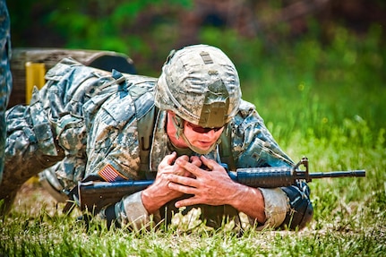 Capt. Christopher J. Ahlemeyer of Rhode Island Air National Guard low crawls during an event in the 27th annual David E. Grange Jr. Best Ranger competition held at Fort Benning, Ga., May 7-10, 2010.