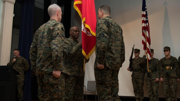 Maj. Gen. Vincent R. Stewart passes the Marine Corps colors Maj. Gen. Daniel J. O’Donohue during a change of command ceremony January 21, 2015 at Fort George G. Meade, Maryland. Stewart relinquished his position as commanding general of Marine Corps Forces Cyberspace to O'Donohue to take the position as director of Defense Intelligence Agency (DIA) and commander of the Joint Functional Component Command for Intelligence, Surveillance and Reconnaissance (JFCC-ISR).  