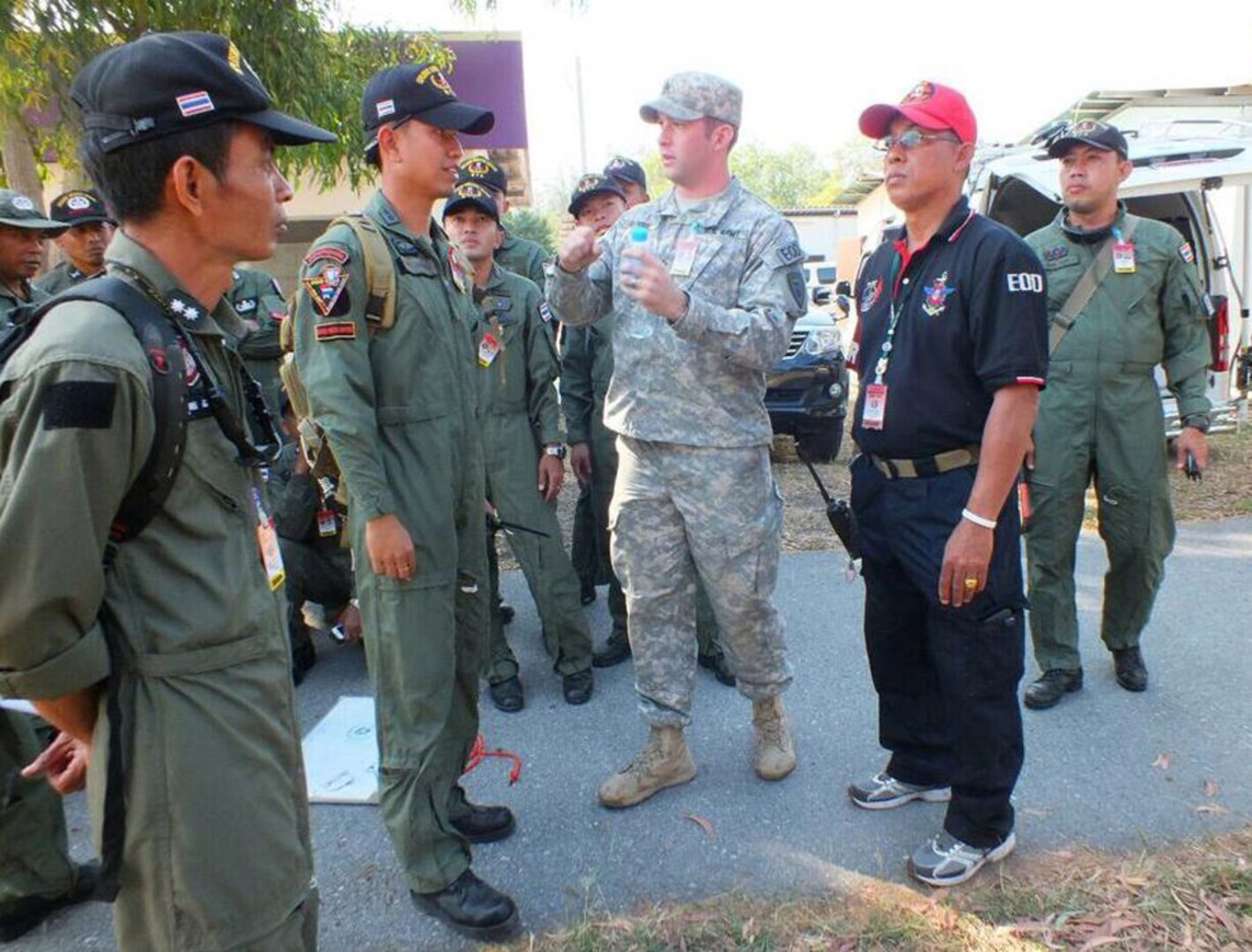 HUA HIN, Thailand (Jan. 16, 2015) - Staff Sgt. Alexander Burdge from the 53rd EOD Company talks through hook and line procedures with his Thai Explosive Ordnance Disposal counterparts.  (U.S. Army Courtesy Photo)