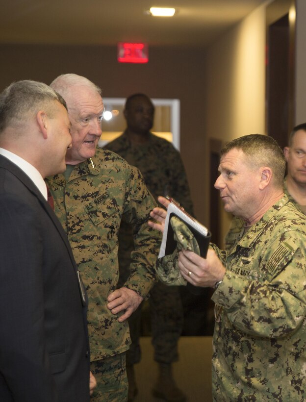 Lt. Gen. Richard P. Mills, commander of Marine Force Reserve (middle), Adm. Bill E. Gortney, commander of U.S. Northern Command and North American Aerospace Defense Command, discuss stories about fallen Marines in the Hall of Ultimate Sacrifice at Marine Corps Support Facility New Orleans, Jan. 21, 2015. The Hall of Ultimate Sacrifice is dedicated to Marines and Sailors who were killed during Operation Iraqi Freedom/Operation Enduring Freedom while serving with Marine Forces Reserve. 