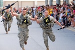 Capt. Robert May (left) and 1st Sgt. Kevin Dylus cross the finish line at the end of the grueling Best Ranger competition at Fort Benning, Ga., May 9, 2010. May and Dylus were one of 25 teams that finished the competition out of 40 that began. The two Soldiers represented the North Carolina Army National Guard.