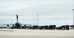 North Dakota's 81st Civil Support Team lines their equipment outside the belly of a C-17 Globemaster at Minot Air Force Base, N.D., May 5, 2010.