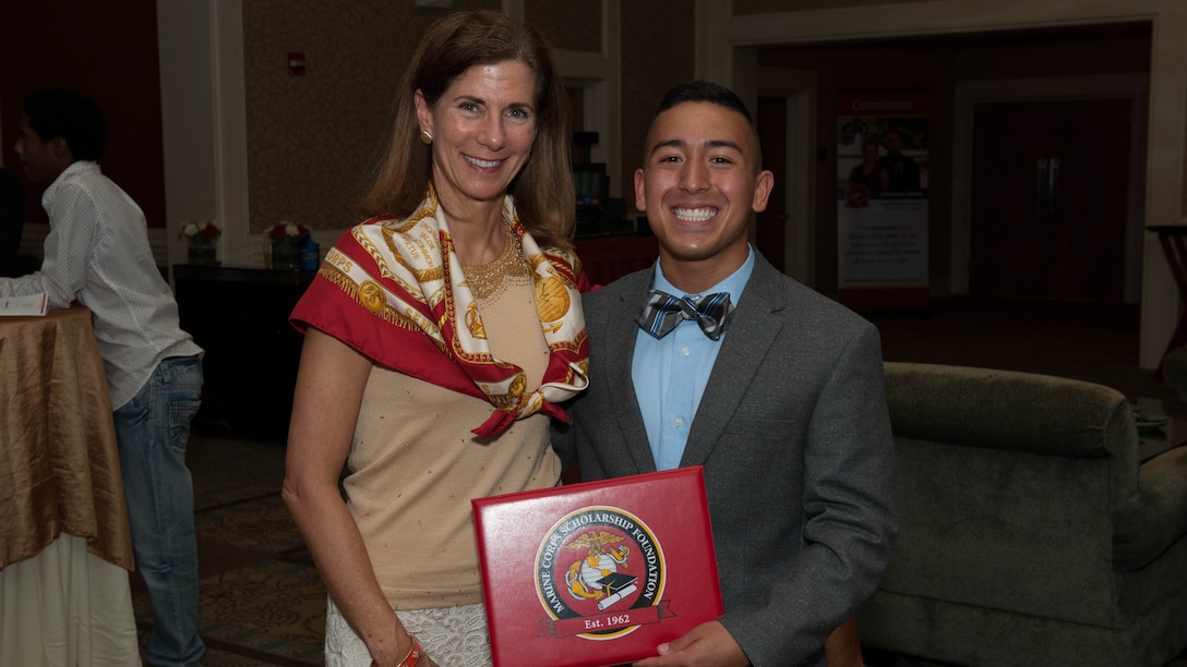 Margaret B. Davis (left) and Isaiah Leiva (right) during the North Carolina Scholarship Announcement Ceremony hosted at the Marston Pavillion in Camp Lejeune on July, 18, 2015.