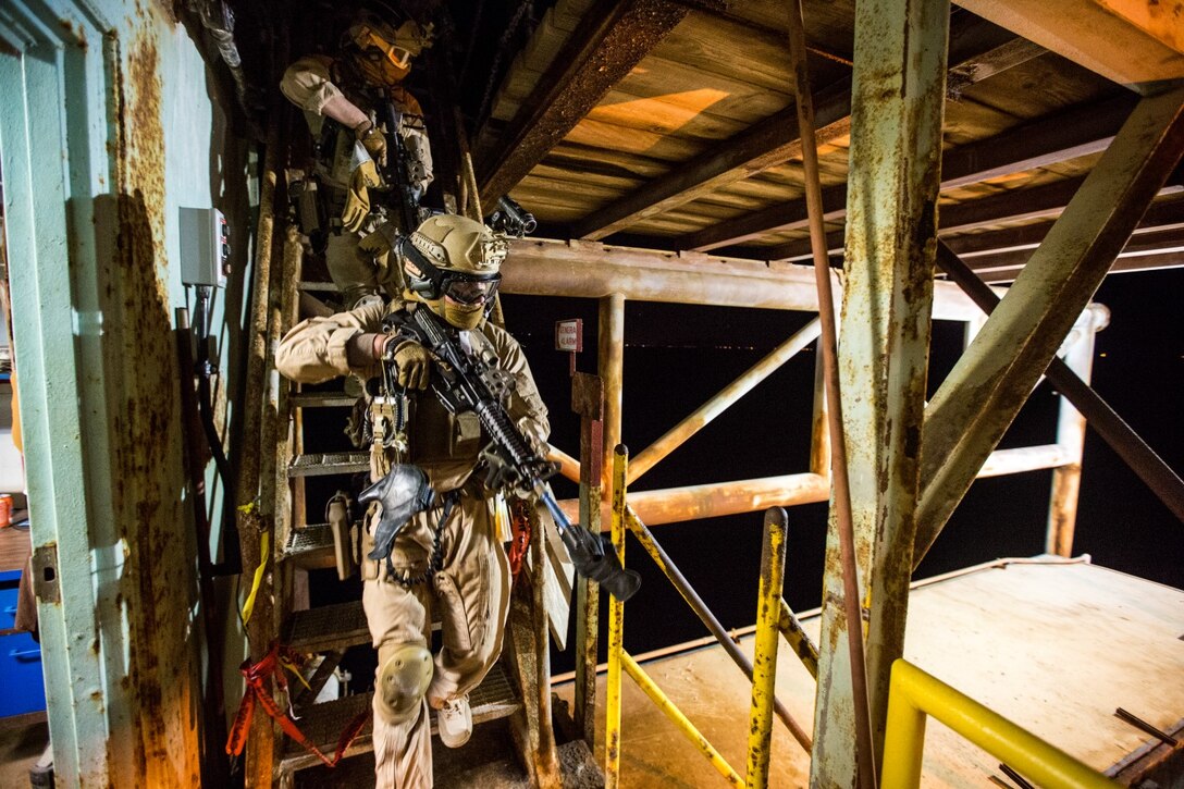 U.S. Marines with the 15th Marine Expeditionary Unit's Maritime Raid Force clear a catwalk during maritime interoperability training off the coast of Santa Barbara, Calif., Jan. 16, 2015. MIT prepares the MRF for their upcoming deployment by enhancing their combat skills, and teaching them techniques for boarding vessels. (U.S. Marine Corps photo by Sgt. Jamean Berry/Released)