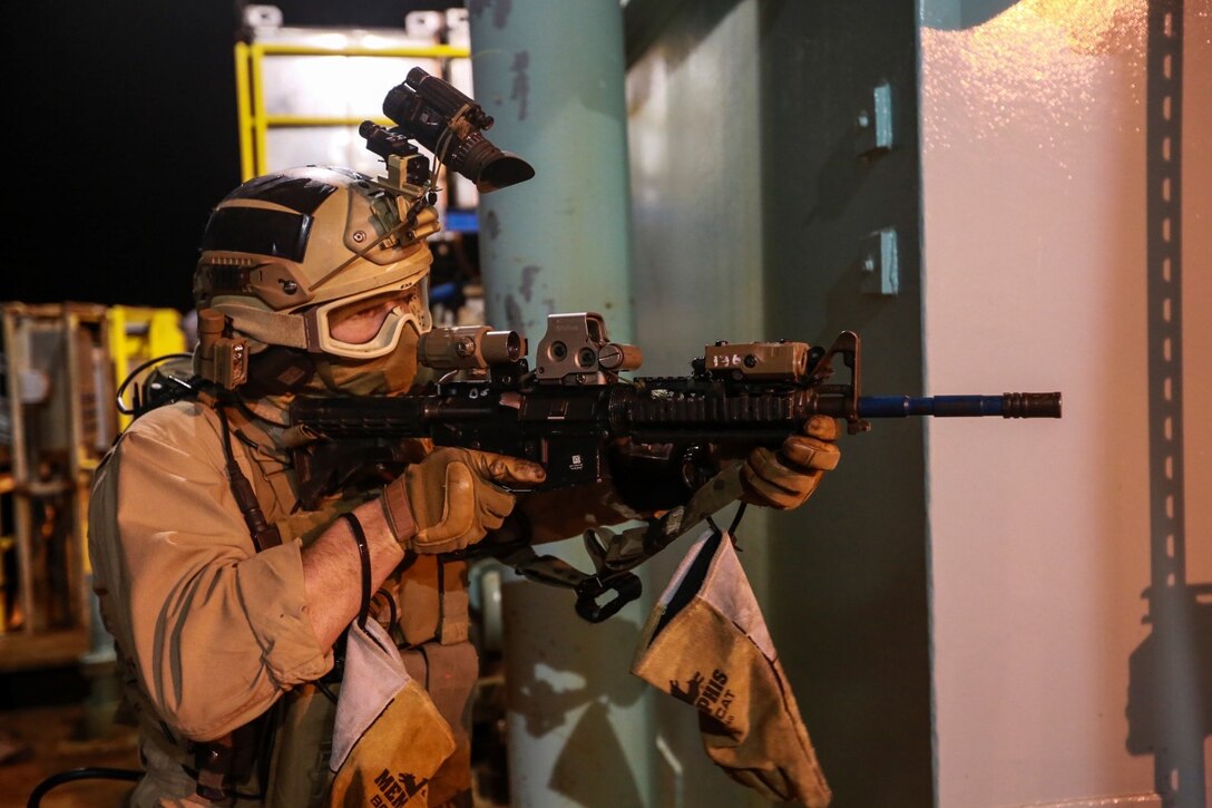 A U.S. Marine with the 15th Marine Expeditionary Unit's Maritime Raid Force provides security during maritime interoperability training off the coast of Santa Barbara, Calif., Jan. 16, 2015. MIT prepares the MRF for their upcoming deployment by enhancing their combat skills, and teaching them techniques for boarding vessels. (U.S. Marine Corps photo by Sgt. Jamean Berry/Released)