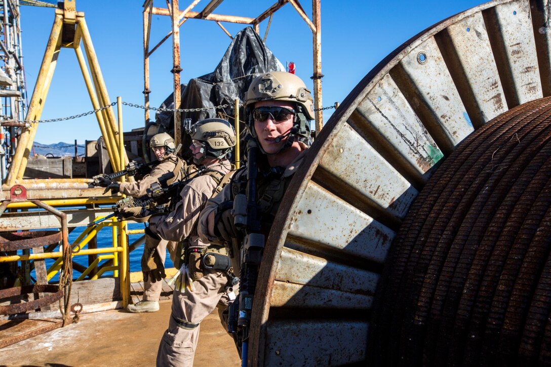 U.S. Marines with the 15th Marine Expeditionary Unit's Maritime Raid Force provide security during maritime interoperability training off the coast of Santa Barbara, Calif., Jan. 16, 2015. MIT prepares the MRF for their upcoming deployment by enhancing their combat skills and teaching them techniques for boarding vessels. (U.S. Marine Corps photo by Sgt. Jamean Berry/Released)