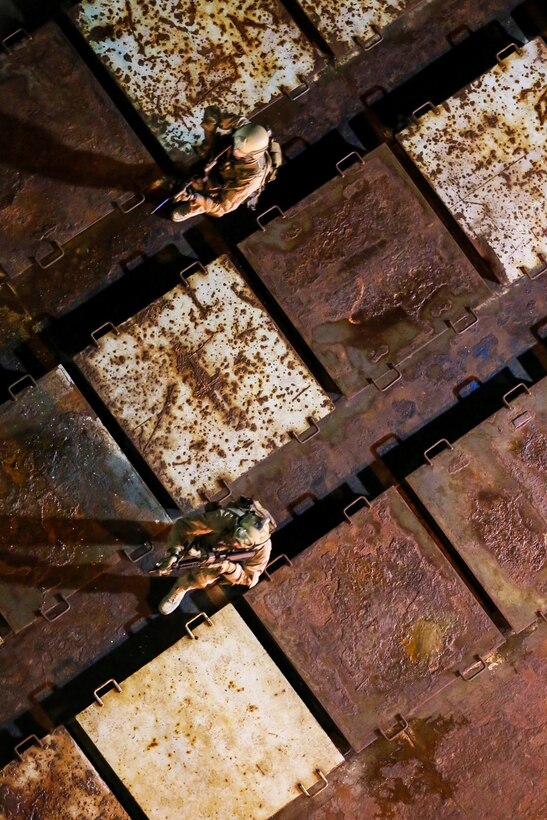 U.S. Marines with the 15th Marine Expeditionary Unit's Maritime Raid Force clear a gas and oil platform during maritime interoperability training aboard the platform Hogan, Santa Barbara County, Calif., Jan. 16, 2015. MIT prepares the 15th MEU's MRF for their upcoming deployment by enhancing their combat skills and teaching them techniques for boarding vessels. (U.S. Marine Corps photo by Sgt. Jamean Berry/Released)