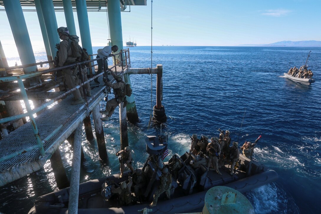 U.S. Marines with the 15th Marine Expeditionary Unit's Maritime Raid Force practice visit, board, search, and seizure techniques during maritime interoperability training off the coast of Santa Barbara, Calif., Jan. 16, 2015. MIT prepares the 15th MEU's MRF for their upcoming deployment by enhancing their combat skills, and teaching them techniques for boarding vessels. (U.S. Marine Corps photo by Sgt. Jamean Berry/Released)