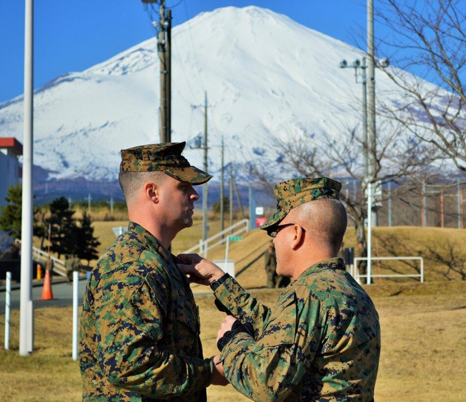 4 January 2015, CATC Camp Fuji, Gotemba, Japan - Sergeant James (PMO, CATC Camp Fuji) is promoted to Staff Sergeant by Major Marshall and Sergeant Major Slattery.