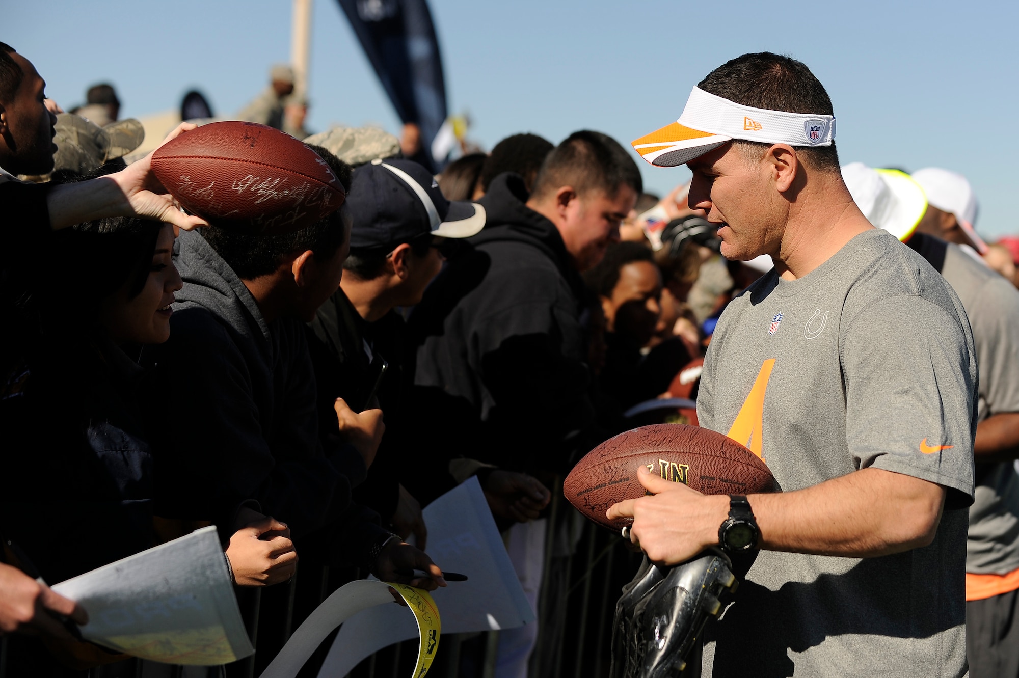 Adam Vinatieri, Indianapolis Colts placekicker assigned to Team Irvin, talks with Airmen and their families after the Pro Bowl practice held at Luke Air Force Base, Arizona, Jan. 22, 2015. Vinatieri was among several Pro Bowl players to come out to Luke to practice for the game this Sunday and to show support for Airmen. (U.S. Air Force photo by Staff Sgt. Staci Miller)