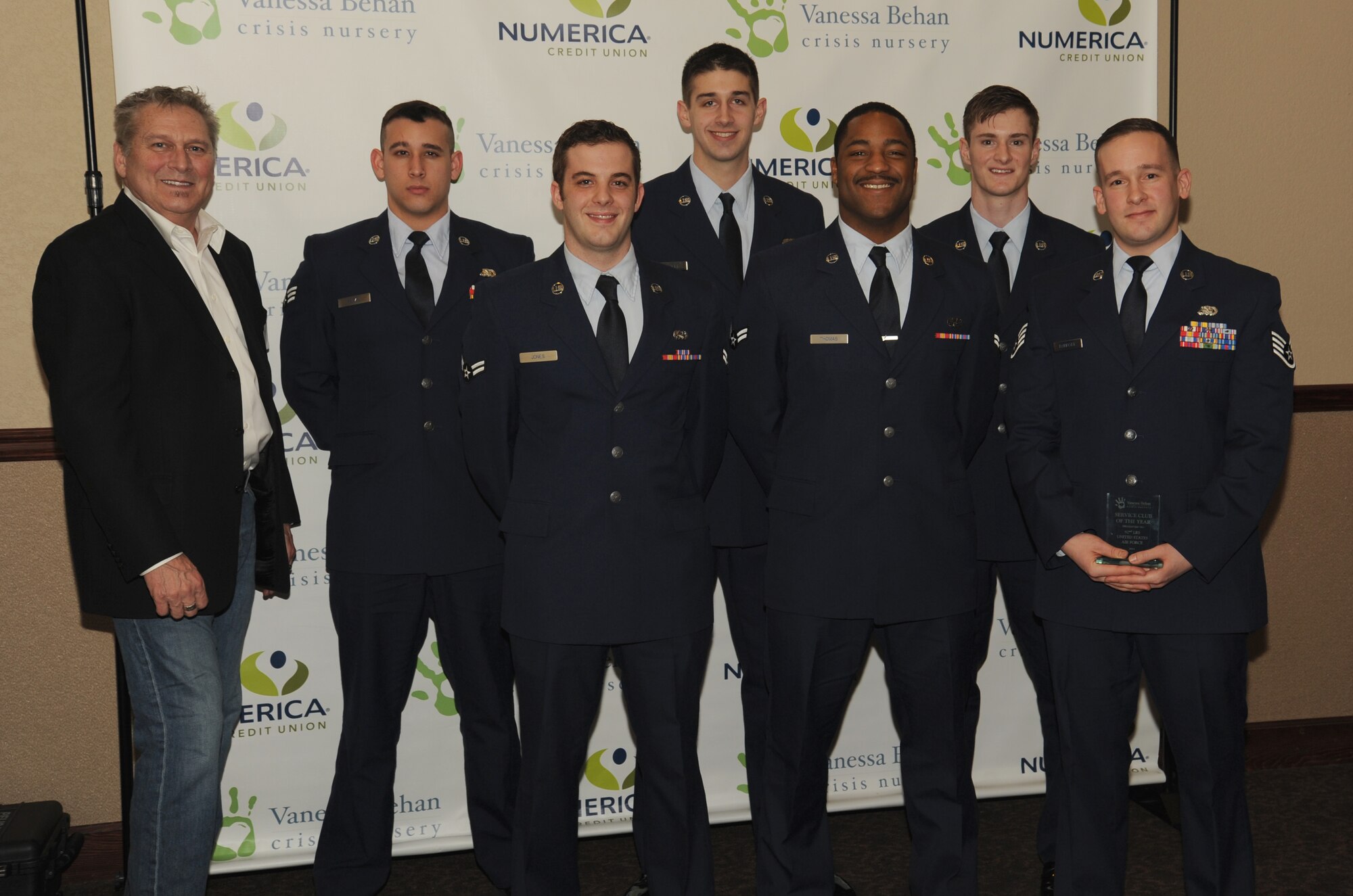 Members from the 92nd Logistic Readiness Squadron are recognized as the service club of the year for 2014, during the 28th annual awards and recognition dinner at the Lincoln Center in Spokane, Washington, Jan. 20, 2015. The 92nd LRS was awarded for their volunteer work for the Vanessa Behan Crisis Nursery. (U.S. Air Force photo/Staff Sgt. Samantha Krolikowski)