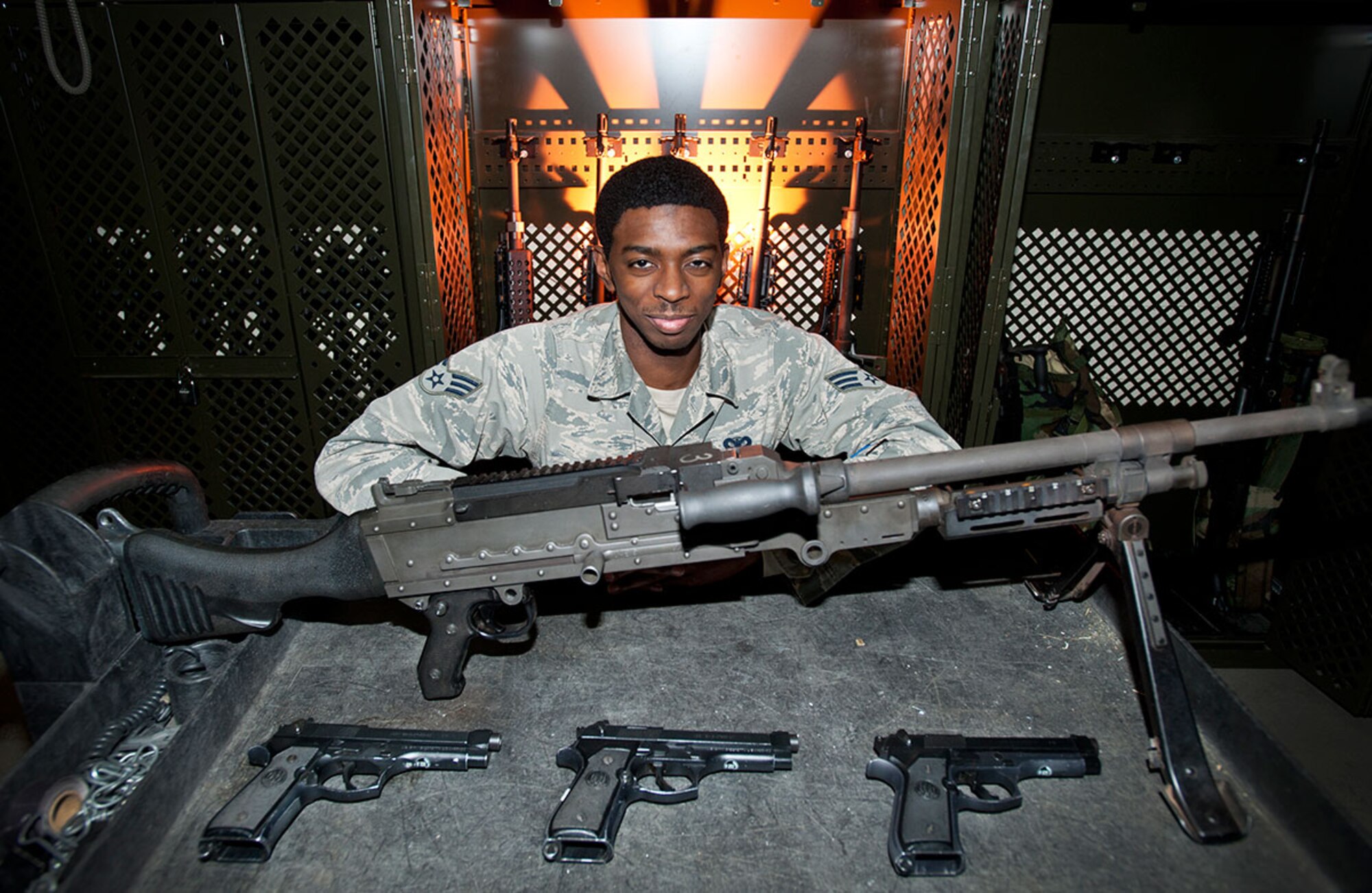 Senior Airman Jamarcus Perry shows off the tools of his trade Wednesday. Perry is a combat arms instructor with the 673d Security Forces Squadron at Joint Base Elmendorf-Richardson, and is a native of Newport News, Va. (U.S. Air Force photo/Tech. Sgt. Robert Barnett)