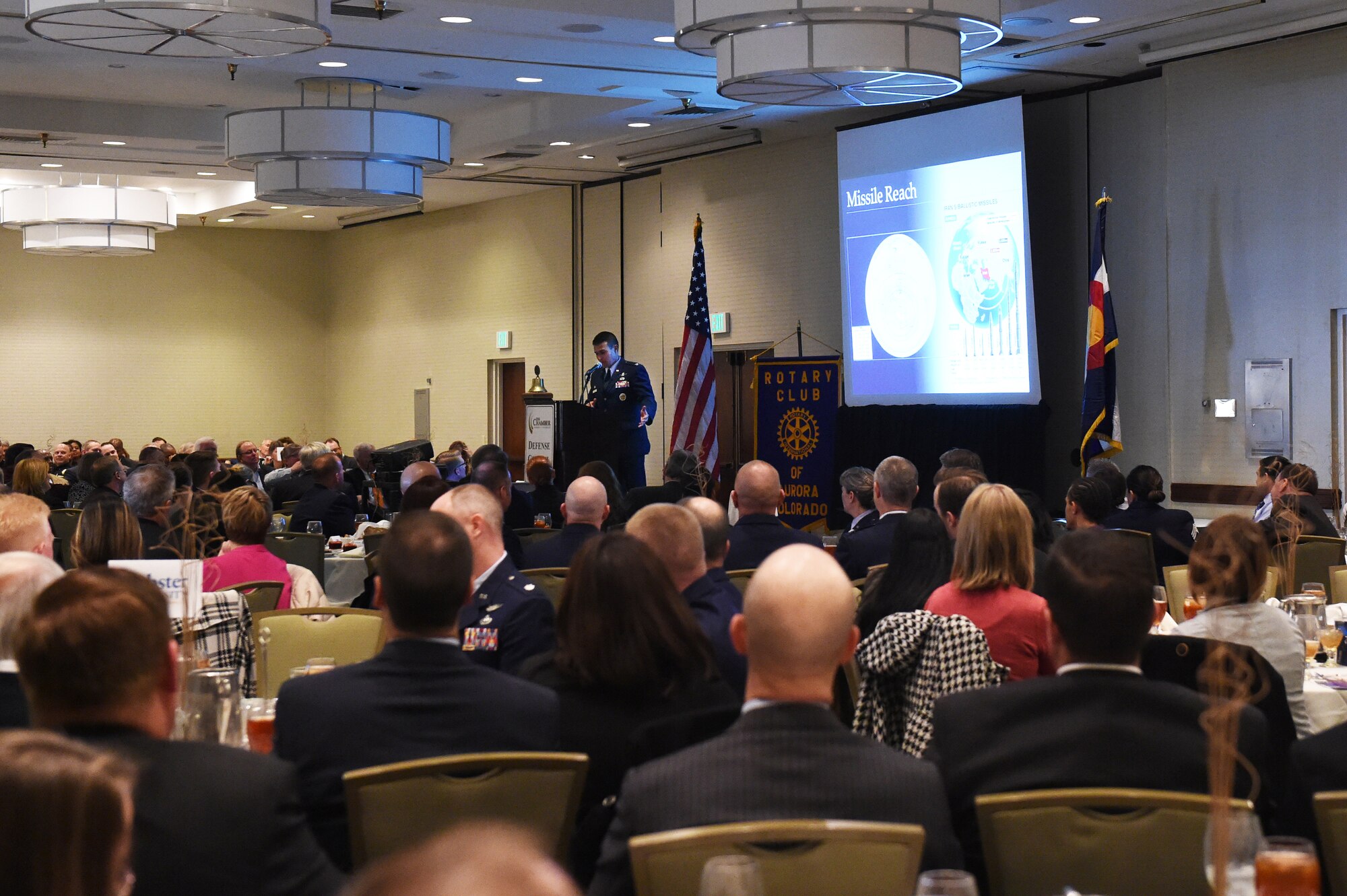 Aurora community leaders listen as Col. John Wagner, 460th Space Wing commander, delivers his State of the Base speech Jan. 21, 2015, at the DoubleTree by Hilton in Aurora, Colo. During the speech, Wagner discussed the base’s mission and current and upcoming events for Team Buckley, along with the base’s economic impact on the community, Aurora Rotary and Aurora Chamber of Commerce. (U.S. Air Force photo by Airman 1st Class Samantha Saulsbury/Released)