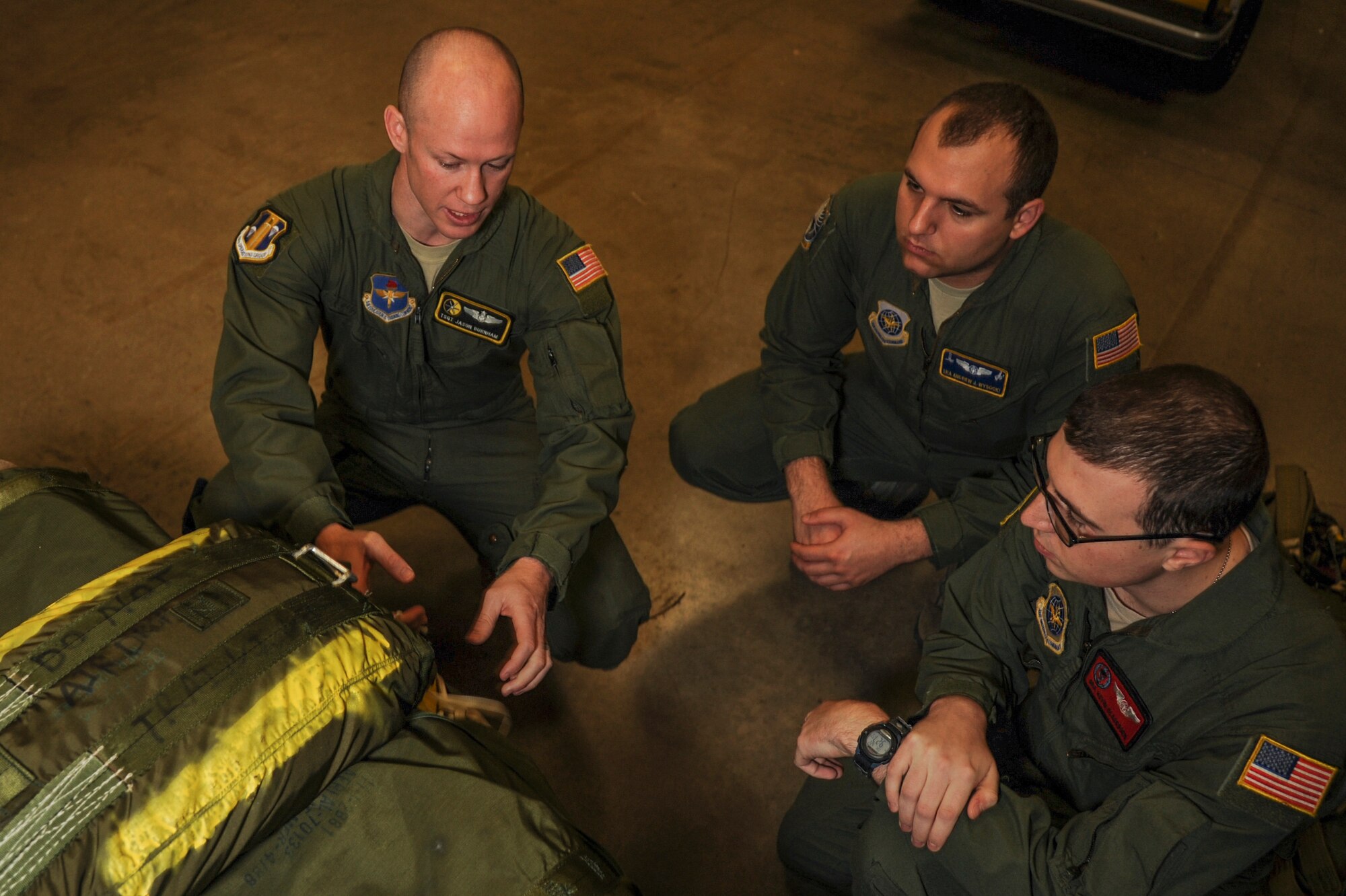Tech. Sgt. Jason Burnham, 314th Operations Group tactics noncommissioned officer in charge and a 48th Airlift Squadron C-130J fuselage training unit instructor, teaches students on the proper way of securing a heavy cargo unit Jan. 22, 2015, at Little Rock Air Force Base, Ark. In 2014 Burnham instructed flight/ground training for more than 300 students. (U.S. Air Force photo by Airman 1st Class Harry Brexel) 
