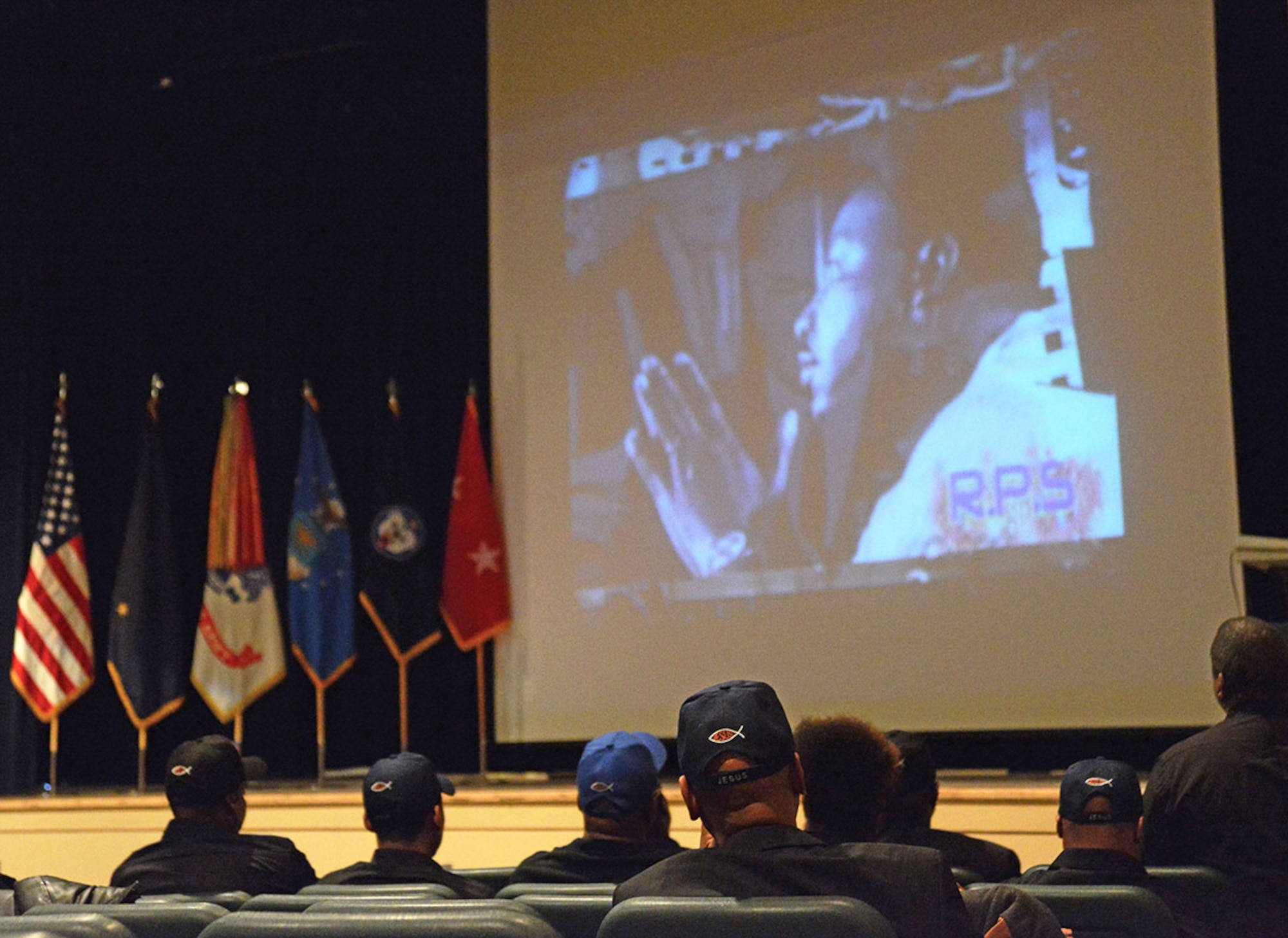 The Shiloh Missionary Baptist Church Choir and Soldiers, Airmen and civilians alike watch a video presentation for the Martin Luther King Jr. Day observance. This event is to remind people Martin Luther King Jr. Day is a day of remembrance and a call to action, not merely a day off. (U.S. Air Force photo/Amn Christopher R. Morales)
