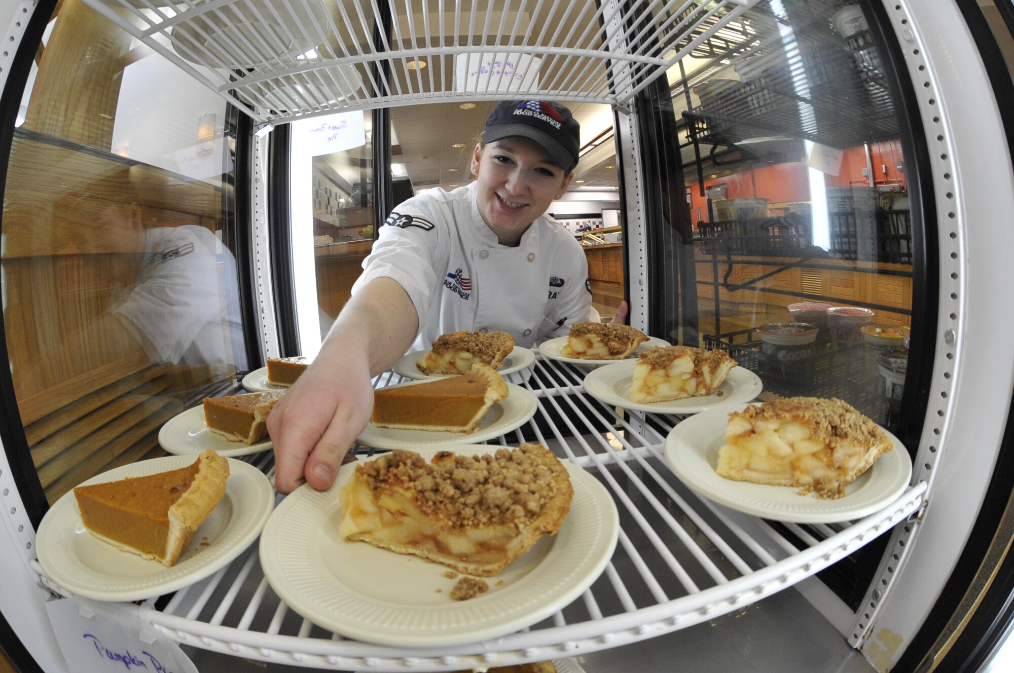 U.S. Air Force Airman 1st Class Sierra Bray, 509th Force Support Squadron food service apprentice, places desserts on a refrigerator shelf at Whiteman Air Force Base, Mo., Jan. 21, 2015. The Ozark Inn dining facility team is preparing to be evaluated for the John L. Hennessy Award inspection. Each year, the Air Force presents the John L. Hennessy Award to recognize the team who best excels in food service. (U.S. Air Force photo by Senior Airman Keenan Berry/Released)