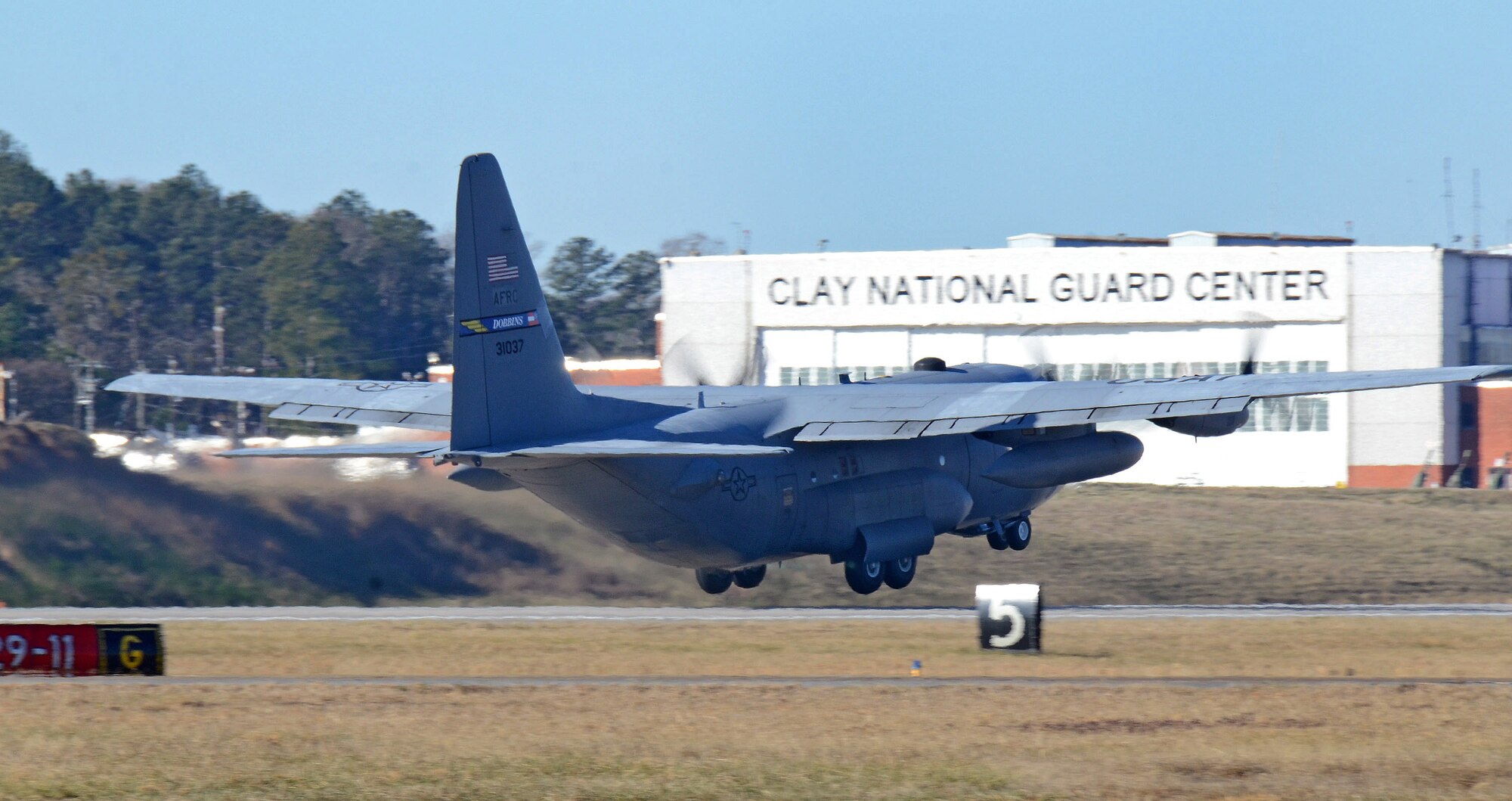 The 94th Airlift Wing C-130H departs the Dobbins runway on its way to Southwest Asia; Dobbins Air Reserve Base, Ga., Jan. 8, 2015. (U.S. Air Force photo/Brad Fallin)