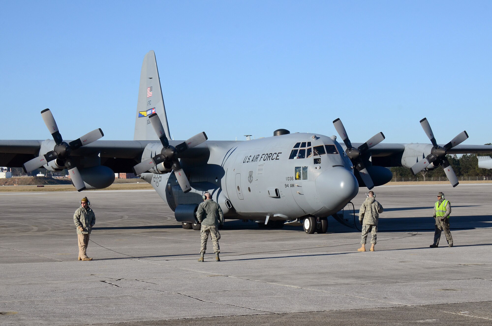 94th Airlift Wing maintenance personnel stand by to monitor engines start for the C-130H aircraft. The aircraft is being readied for deployment to Southwest Asia, Jan. 8, 2015 at Dobbins Air Reserve Base, Ga.  (U.S. Air Force photo/Brad Fallin)