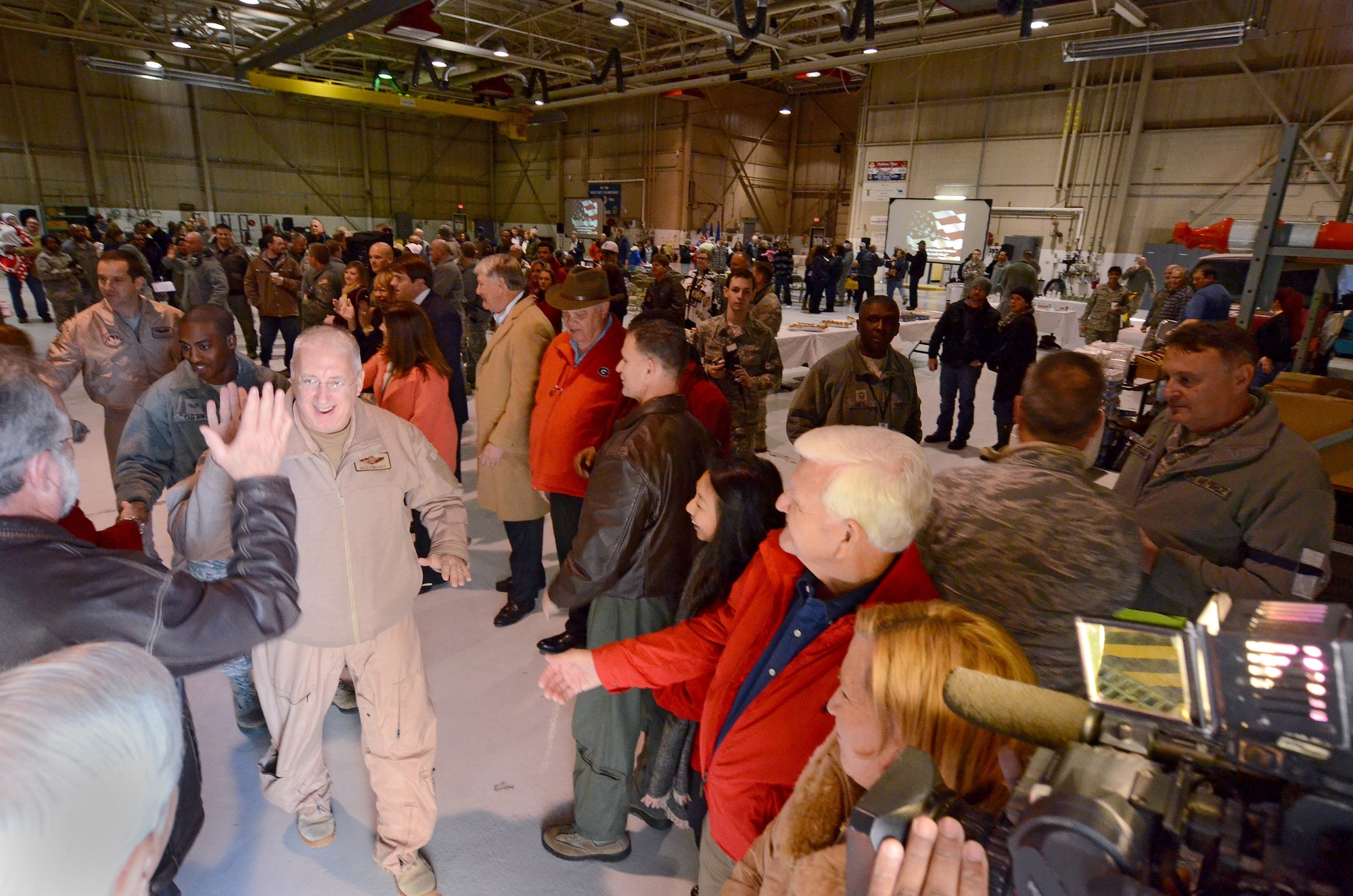 94th Airlift Wing and community leaders say goodbye to deploying members of the wing as they make their way to the flight line to board their C-130H aircraft Jan. 8, 2015 at Dobbins Air Reserve Base, Ga.  (U.S. Air Force photo/Brad Fallin)