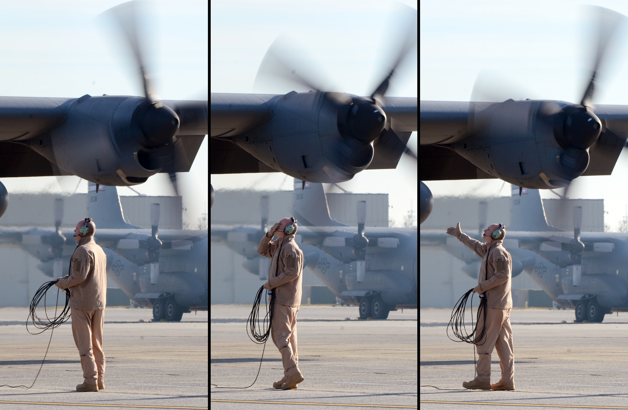 After all four engines have started Stan Eval Loadmaster, Senior Master Sgt. Bill Hutchinson says goodbye to his family, observing from the fence line, as the 94th Airlift Wing Hercules is nearly ready to deploy to Southwest Asia, Jan. 5, 2015. (U.S. Air Force photo/Brad Fallin)