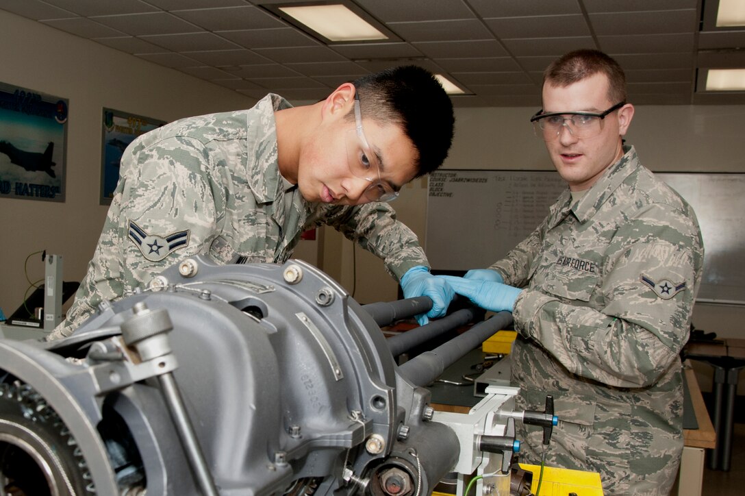 Airman 1st Class Brian Wu and Airman Joseph Arns, 363 Training Squadron
inspect gun barrels after doing an inspection on an F-15 Eagle armament
weapon system at Sheppard Air Force Base, Texas, Jan. 20, 2015. The mission
of the 363rd TRS is to provide the world's best highly trained and motivated
aircraft armament system personnel to support global engagement.  (U.S. Air
Force Photo Danny Webb/Released)
