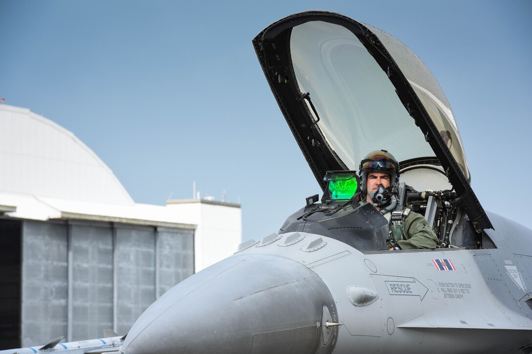 U.S. Air Force Lt. Col. Chad Holesko, an F-16 pilot from the 180th Fighter Wing, prepares for a training sortie on the flight line of Naval Station Key West, Boca Chica Island, Florida, Jan. 12, 2015. The 180th Fighter Wing deployed to Key West to conduct dissimilar aircraft training with F-15’s from the 159th Fighter Wing, from New Orleans and F-5’s from Naval Station Key West. (Air National Guard photo by Staff Sgt. Amber Williams/Released)