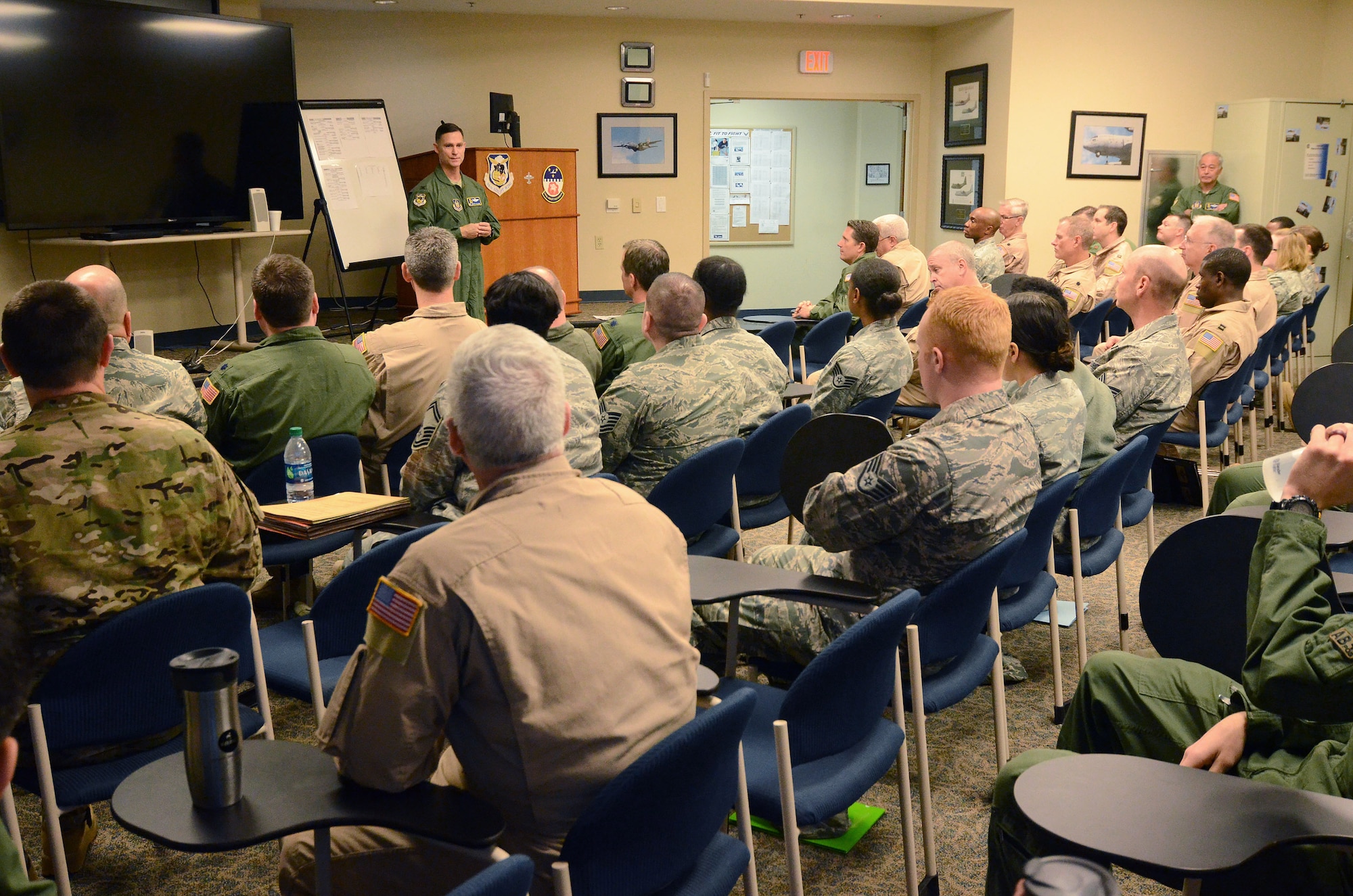 Col. Brett Clark, commander 94th Airlift Wing, addresses members of the wing prior to their deployment to Southwest Asia; Dobbins Air Reserve Base, Ga., Jan. 2, 2015. (U.S. Air Force photo/Brad Fallin)