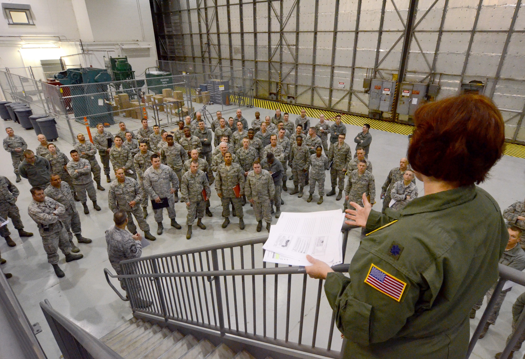 Lt. Col. Michele Fletcher briefs 94th Maintenance Group personnel at Dobbins Air Reserve Base, Ga., on medical issues they may encounter while deployed to Southwest Asia, Jan. 2, 2015. (U.S. Air Force photo/Brad Fallin)