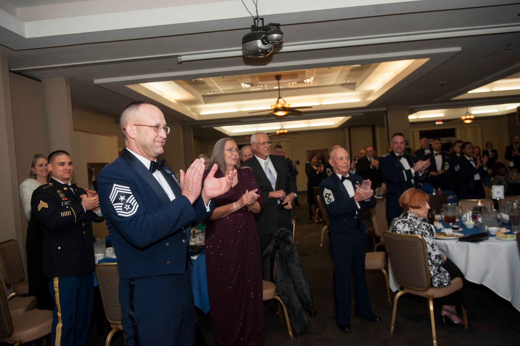 U.S. Air Force Chief Master Sgt. David Kelch, 23d Wing command chief, claps for the new chief master sergeants select during the 2015 Chief Master Sergeant Recognition Ceremony Jan. 16, 2015, at Moody Air Force Base, Ga. The rank of chief master sergeant was first awarded to 625 Airmen in 1959. (U.S. Air Force photo by Senior Airman Jarrod Grammel/Released)
