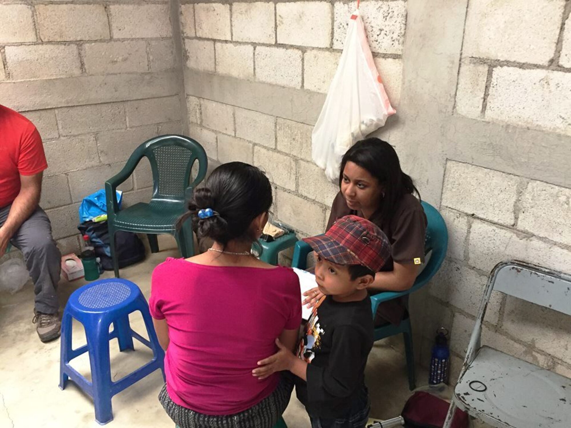 Physician Assistant, Daizha Gallo with T.I.M.E. for Christ Mexico Ministries in the village of Guachapulin interviewing a patient and her young son before an exam. She and her family travelled to Guatemala during the month of December to provide medical assistance.(Courtesy photo/Cheryl Chrisman) 