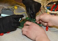 341st Missile Maintenance Squadron Airmen practice their soldering skills at the 341st MMXS training area at Malmstrom Air Force Base, Mont., Jan. 20, 2015. Good soldering skills translate into less repairs down the road, meaning communications lines are up for longer. (U.S. Air Force photo/Airman 1st Class Dillon Johnston)
